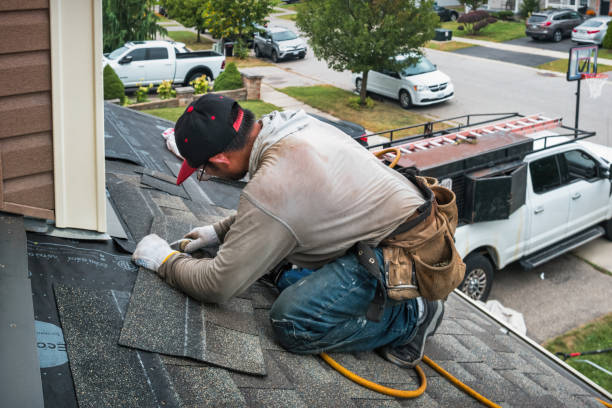 Professional Roofing technician working in Manhasset, NY
